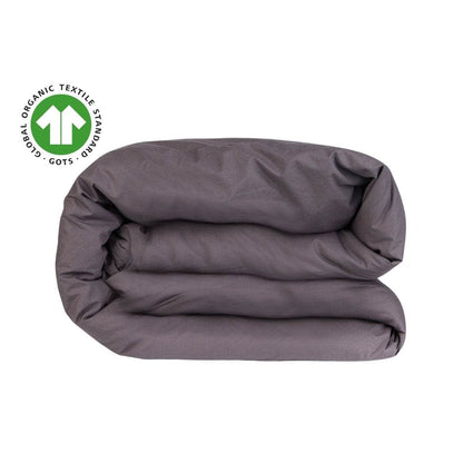 Folded maron organic cotton cover  blanket with a GOTS logo on a white background
