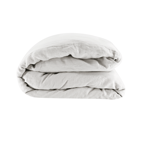 Folded light gray linen cover comforter on a white background