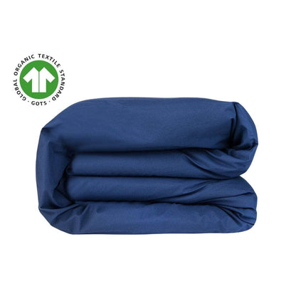 Folded blue fabric with Global Organic Textile Standards (GOTS) logo on a white background