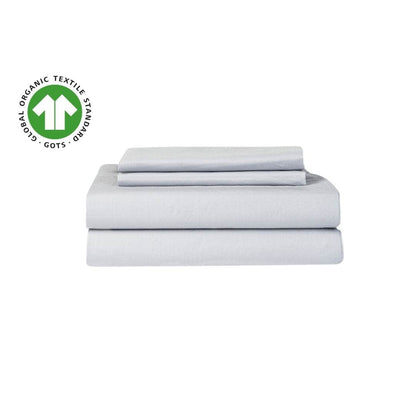 Set of light gray bed sheets with a Global Organic Textile Standards (GOTS) logo on a white background.