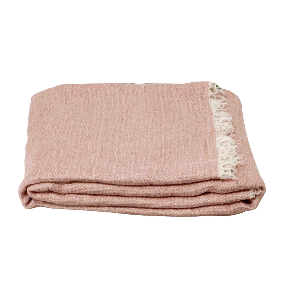 Folded pink linen throw blanket with white fringe on a white background