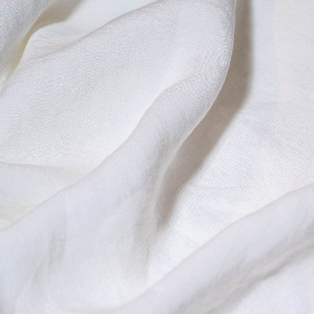 Close-up of white linen fabric with soft folds