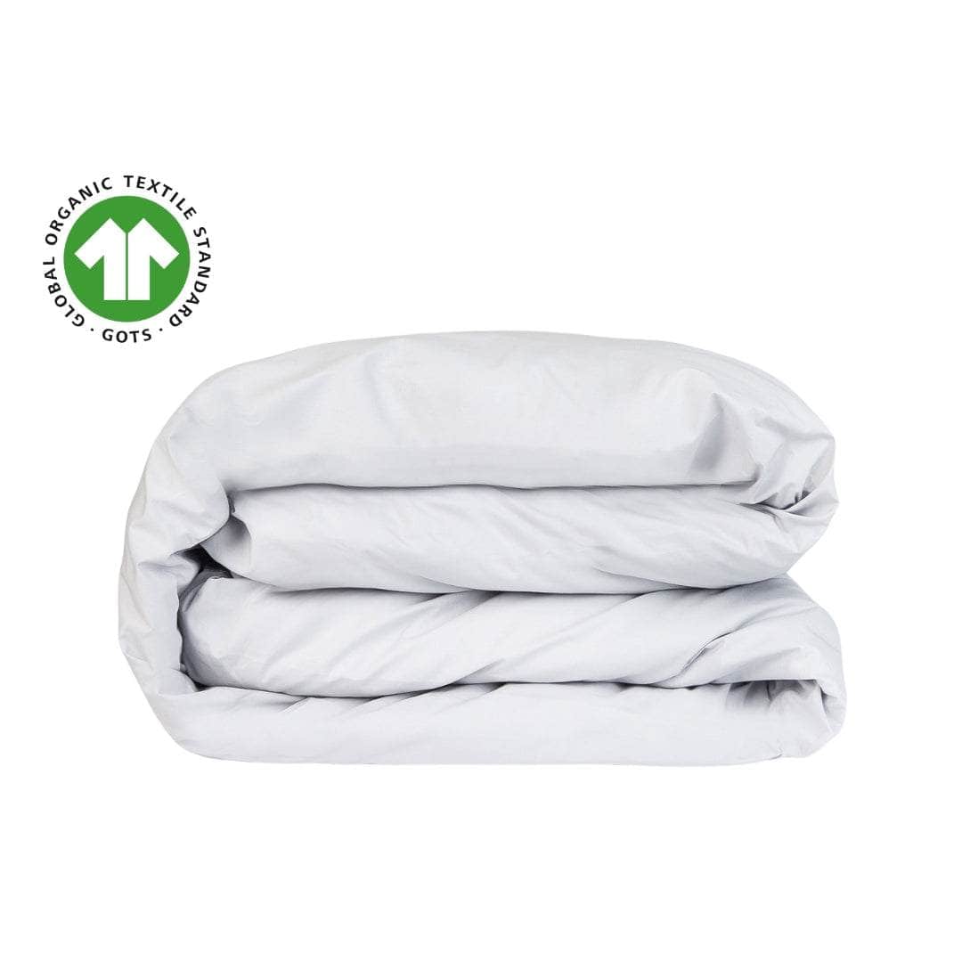 Folded light gray comforter with Global Organic Textile Standards logo on a white background